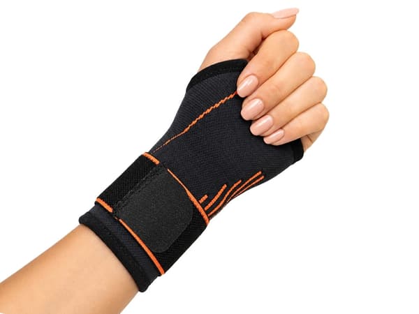 Håndledsstøtte med tommelfingerhul og kardborrelukning grå/orange 16 cm