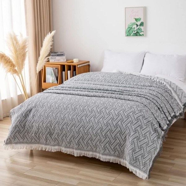 Multifunksjonelt sengeteppe eller sofateppe, grått og hvitt flettet sofateppe med dusker 180 x 230 cm Grå + Hvit