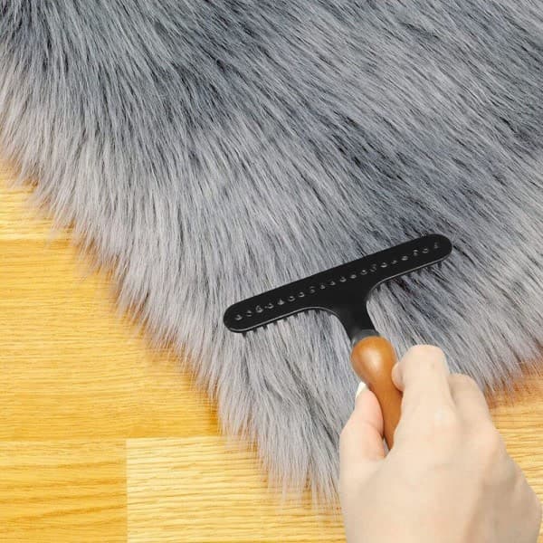 Teppekam for å fluffe opp tepper