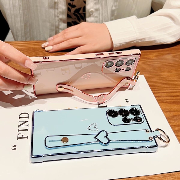 Etui til Samsung Galaxy S24 Ultra med håndleddsstropp og kickstand, kjærlighetshjertemønster, forgylt kant, myk TPU støtsikker deksel for kvinner