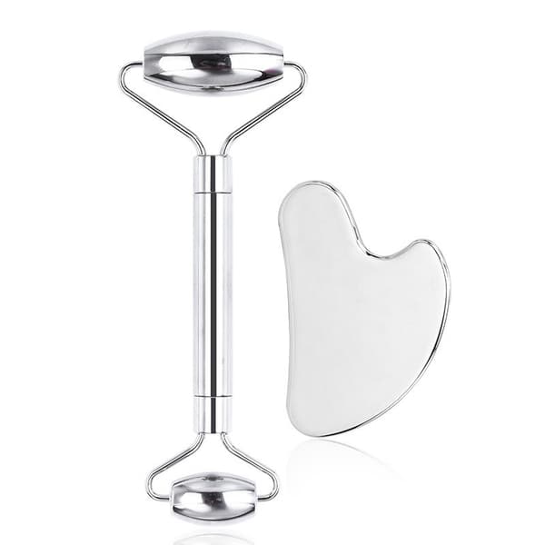 Gua sha sæt i rustfrit stål og ansigtsmassage roller, egnet til ansigts-, øjen- og nakkemassage.