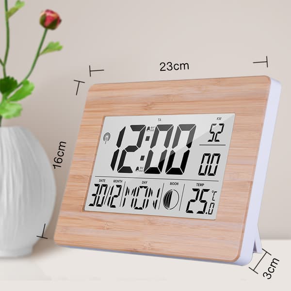 Radiostyrd digital klocka med tidssignal, äkta bambuhölje, LCD-display, termometer, väckarklocka och kalender. Batteri ingår