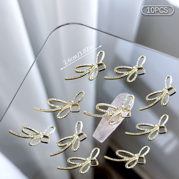 10 kpl DIY Nail Art Decoration 3D Sliver / kultainen rusetti kynsipora 10Pcs Gold 12*26mm