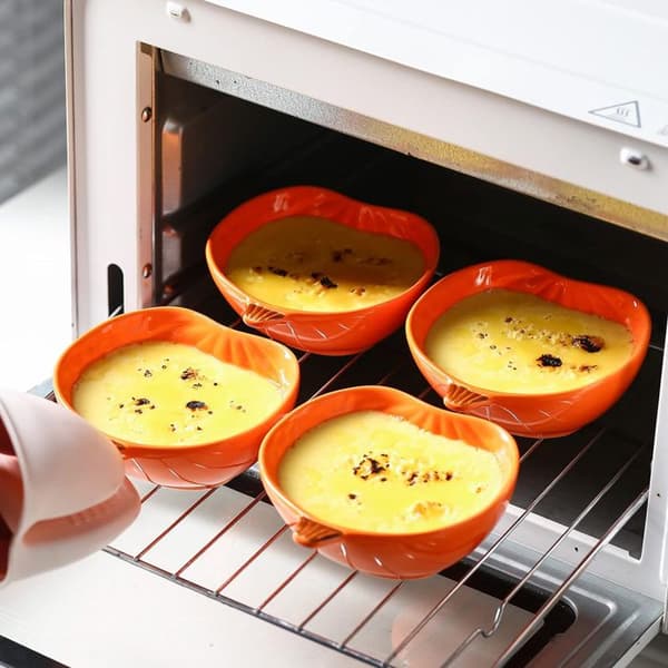 Set med 4 keramikformar i pumpaform, ugnssäkra, för höstkryddor och desserter.