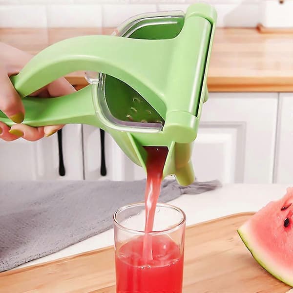 Presset appelsin sitron granateple vannmelon juice kjøkkenjuicer pressing