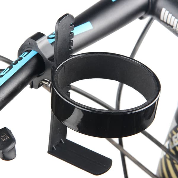 En gul cykel med holder til kaffekopholder mælk te