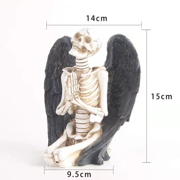 Dekorativ present knäböjande bevingade skelettfigurer, konstnärlig skulptur
