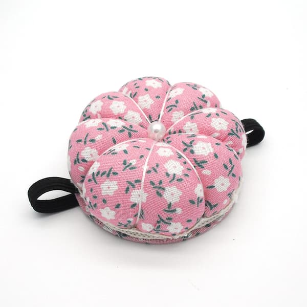 Set med 2 gröna och rosa pumpa nålkuddar med elastiskt gummiband