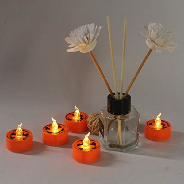 Halloween 12 stk Orange LED Teelys Gresskar Smilende Ansikt Trykk Varmt Hvit Flimrende Batteridrevet Flammeløse Lys for Hjemmedekor Jul