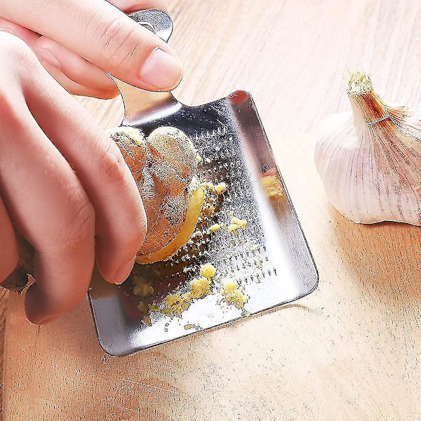 Inkivääriraastin, ruostumattomasta teräksestä valmistettu lapiomainen raastin inkiväärille, valkosipulille, hedelmille ja juureksille