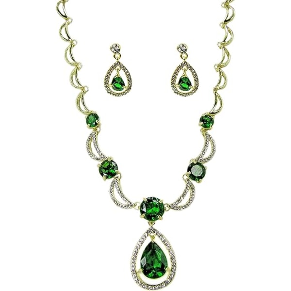 Grönt kristallhalsband och örhänge set med droppvis och runda gröna kristaller och böjt länkhalsband. Elegant och tidlöst set i kristall