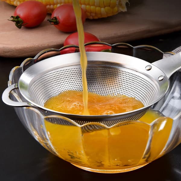 Soyamelk og juice finmasket silskje med langt ergonomisk håndtak og rustfritt stålmateriale