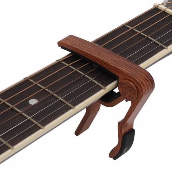Zerone Gitarr Capo Snabbkoppling Strängklämma Tillbehör Kit Capo med 5st Gitarrplektrum för Banjo