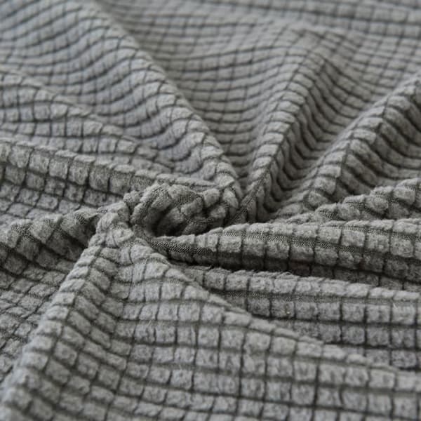 Elastisk, sklisikkert sofatrekk med vaffelmønstret fleece i grått