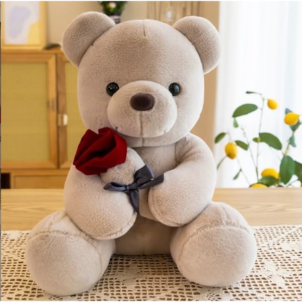Sød og krammelig bamse, 25 cm med rose. Blød pelsbamse. Udstoppede bamse. Lavet af