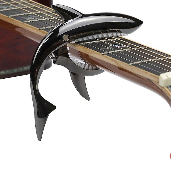 Musta-sinkkiseoksesta valmistettu kitara Shark Capo akustiselle ja sähköiselle kitaralle