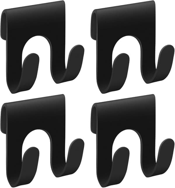 A set of four black shower caddy accessories, with double hooks to hold bath sponges.