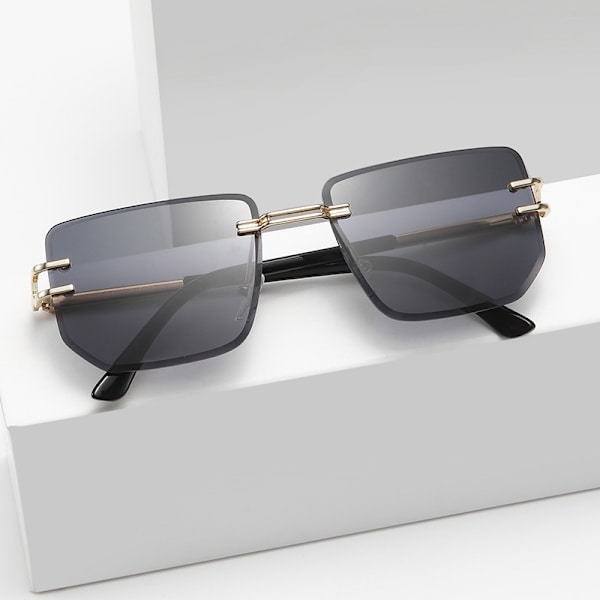 Snygga bågfria solglasögon Retro metallsolglasögon för kvinnor Modeglasögon för män Gold frame gradient grey