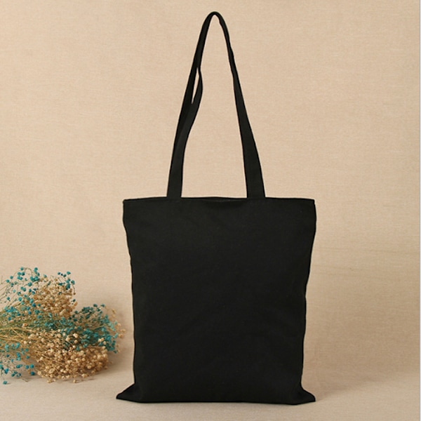 1 axelväska i canvas 35*40cm svart black