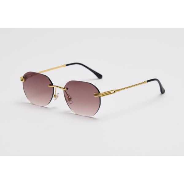 Trendiga solglasögon för dam sommar 2022 snurrade skalmar guld brown Model 3