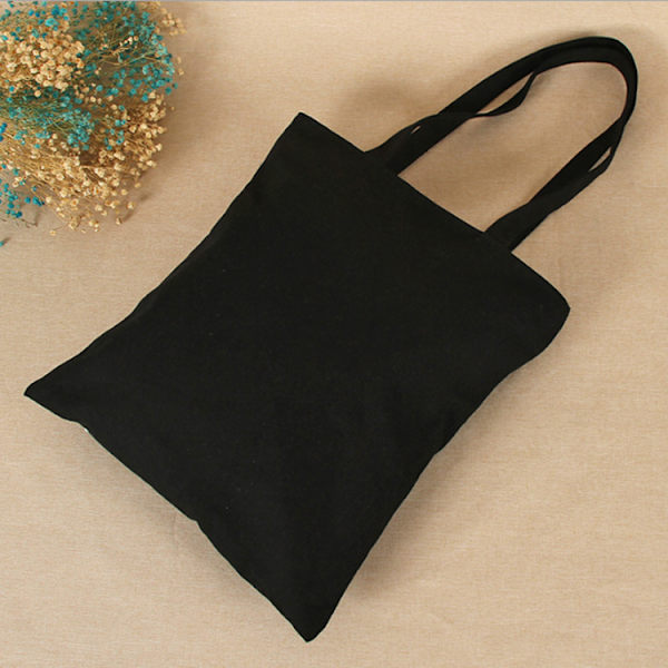 1 axelväska i canvas 35*40cm svart black