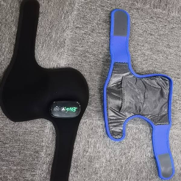 Elektrisk uppvärmd massageknäskydd 3 i 1 vibrerande uppvärmning