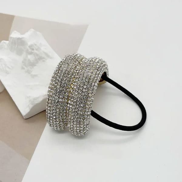 Trendande elastisk hårband med geometriska strass i raffinerad guld. Gul