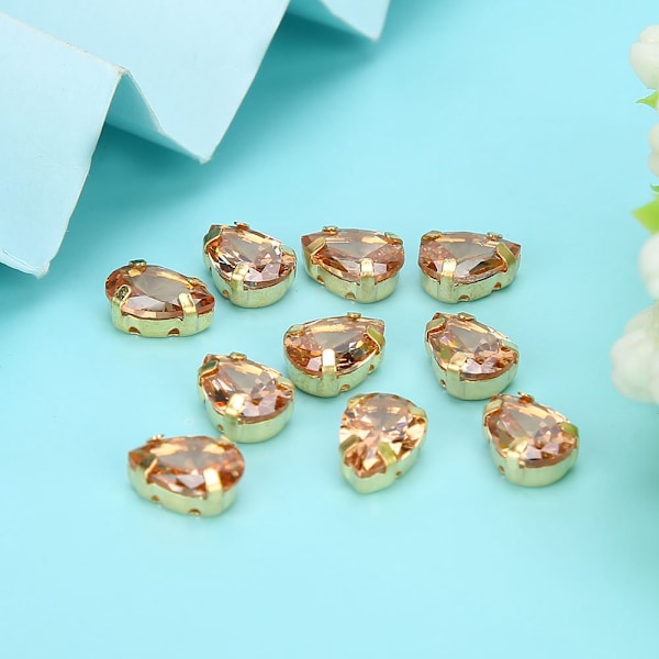 10 st sy rhinestones gyllene klo DIY rosett kläder tillbehör 7x10mm champagne