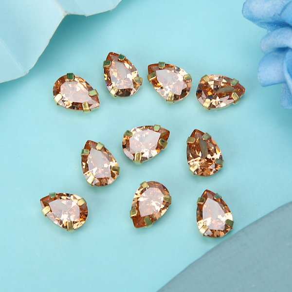 10 st sy rhinestones gyllene klo DIY rosett kläder tillbehör 7x10mm champagne