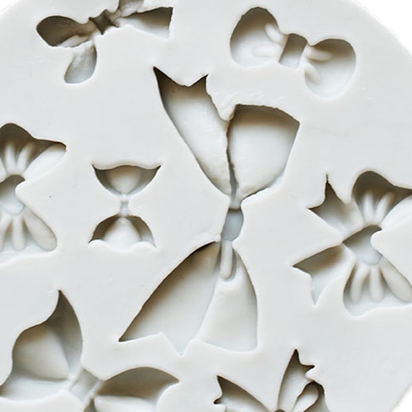 Silikoninen nail art mold -itse valu rusetin muotoinen veistetty kuviollinen kynsien mold riipukseen suklaanharmaa