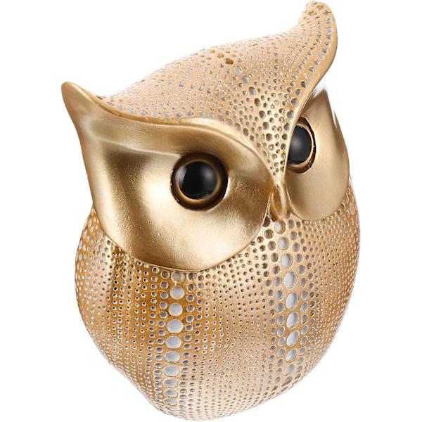 Gylden metaluglefigur - elegant hjemmekontorindretning