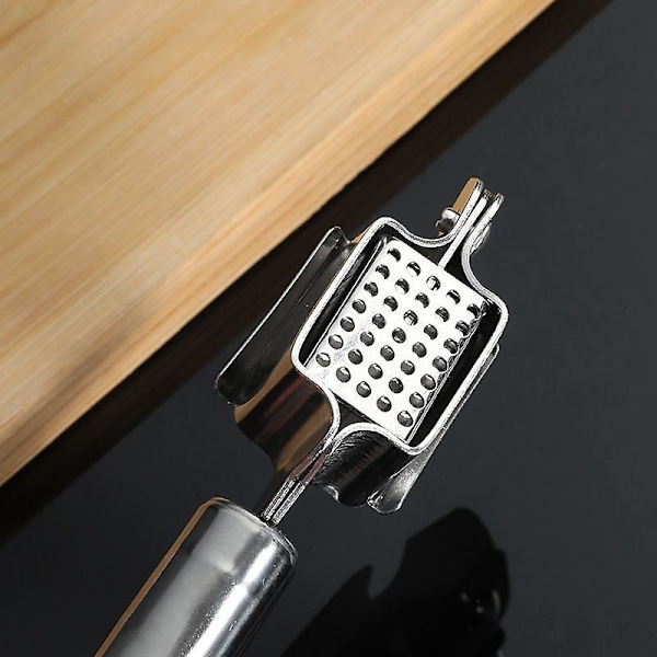 Hvitløkspresse i rustfritt stål for enkel knusing av hvitløk og ingefær med ergonomisk design
