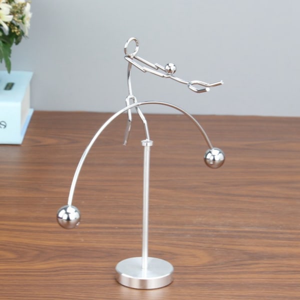 Metalli tasapainottava heiluri, 2 henkilöä tanssii Innovatiivinen stress relief lelu toimistotyöpöytälahja