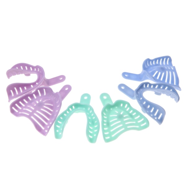 6 kpl sekavärisiä muovisia hampaiden jäljennösalustoja Hammasmateriaalien pidike