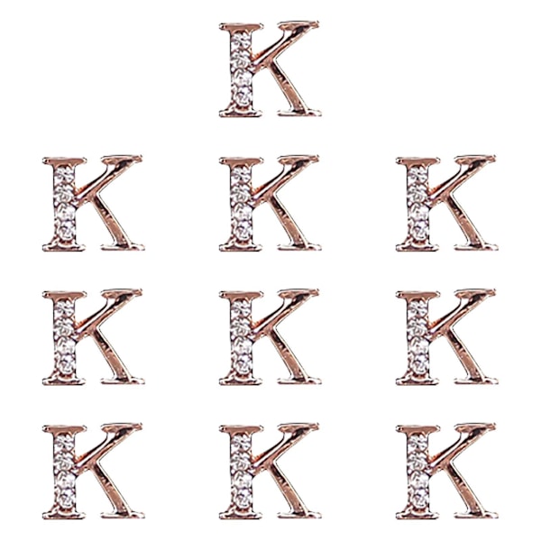 Kultaiset 3D-kynsikoristeet - 26 kirjainta strassilla kynsistudioille (10 kpl)
