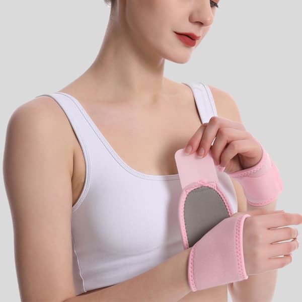 Svettabsorberande handledskompressionrem Elastisk justerbar handledslinda Stöd Skyddande bandage för senskida stukning Rosa
