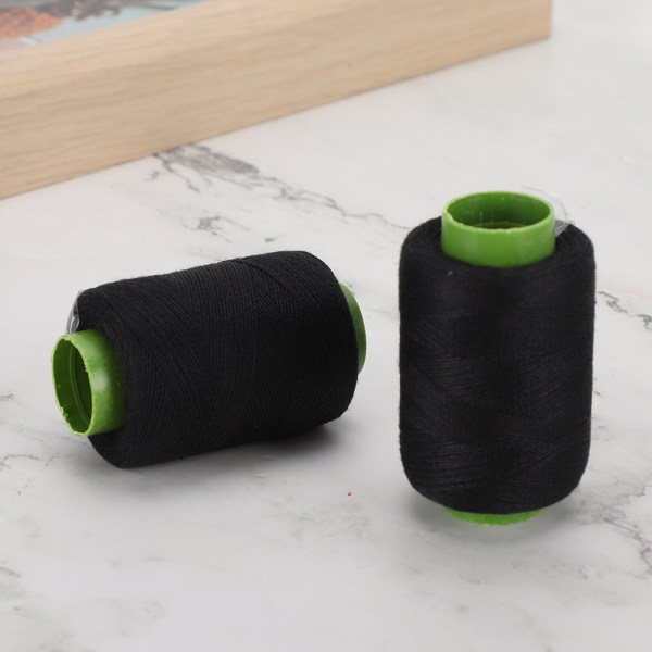 Musta lanka kirjonta polyesterilankapuola tikkausompelukoneen käsinompeluun