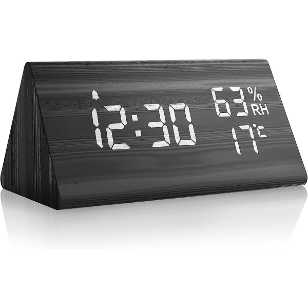 Svart digital väckarklocka i trä med snooze, datum, temperatur och luftfuktighet
