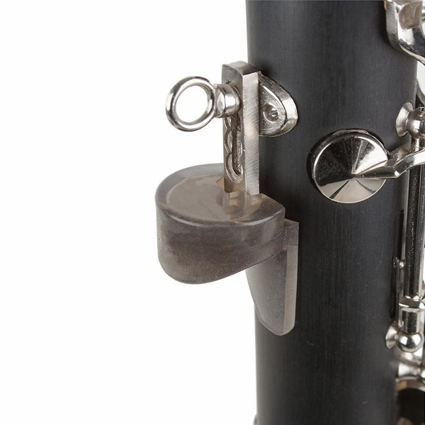 Säädettävä klarinetin peukalonsormituki, jossa kumityynysuoja klarinetille